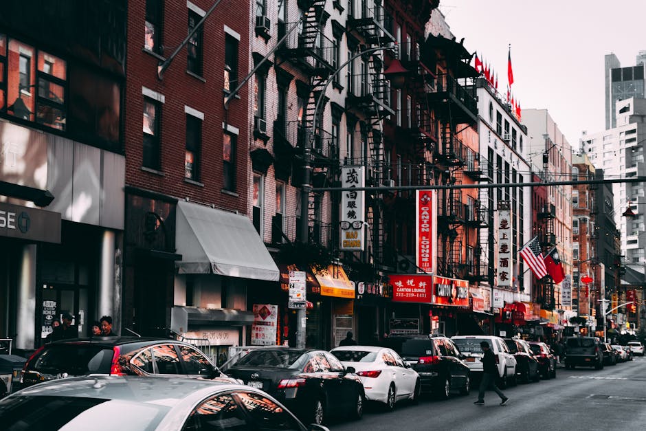Busy urban street scene featuring traffic and city buildings in daylight, capturing vibrant urban life.
